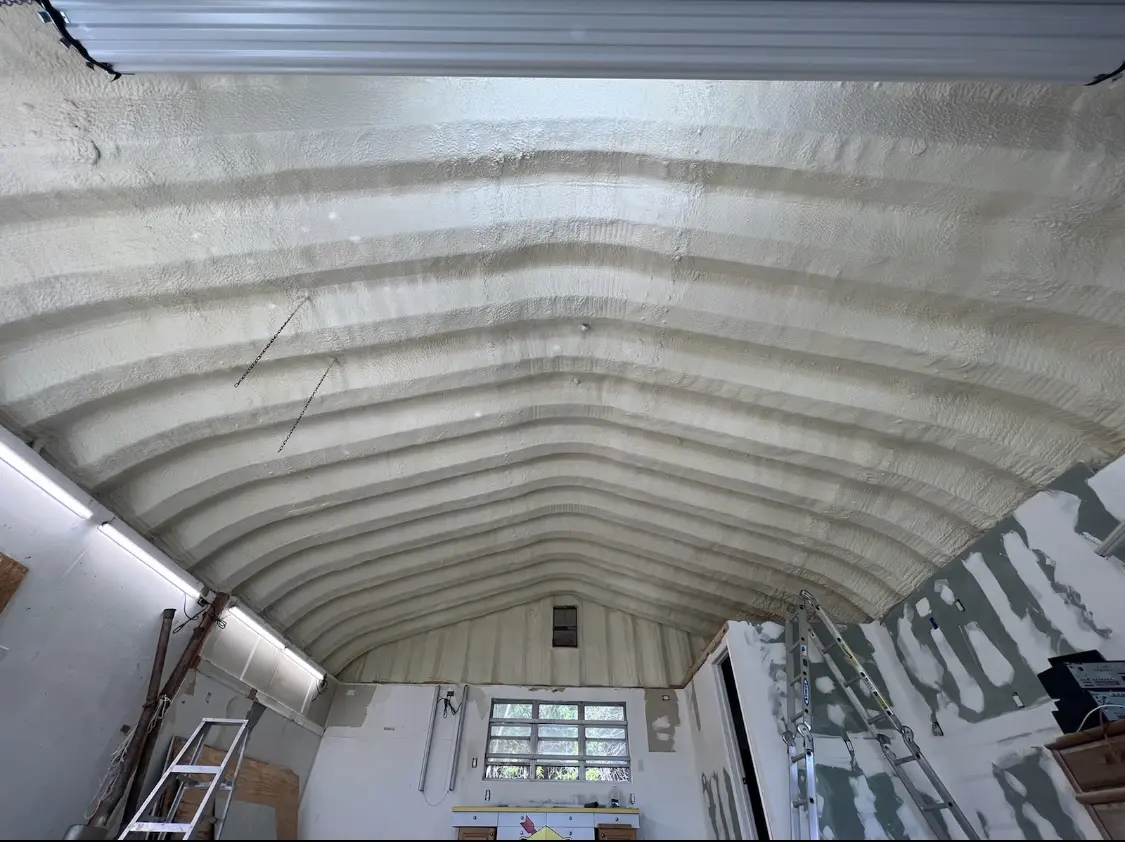 Spray polyurethane foam applied to the underside of a metal roof deck in Rockwall